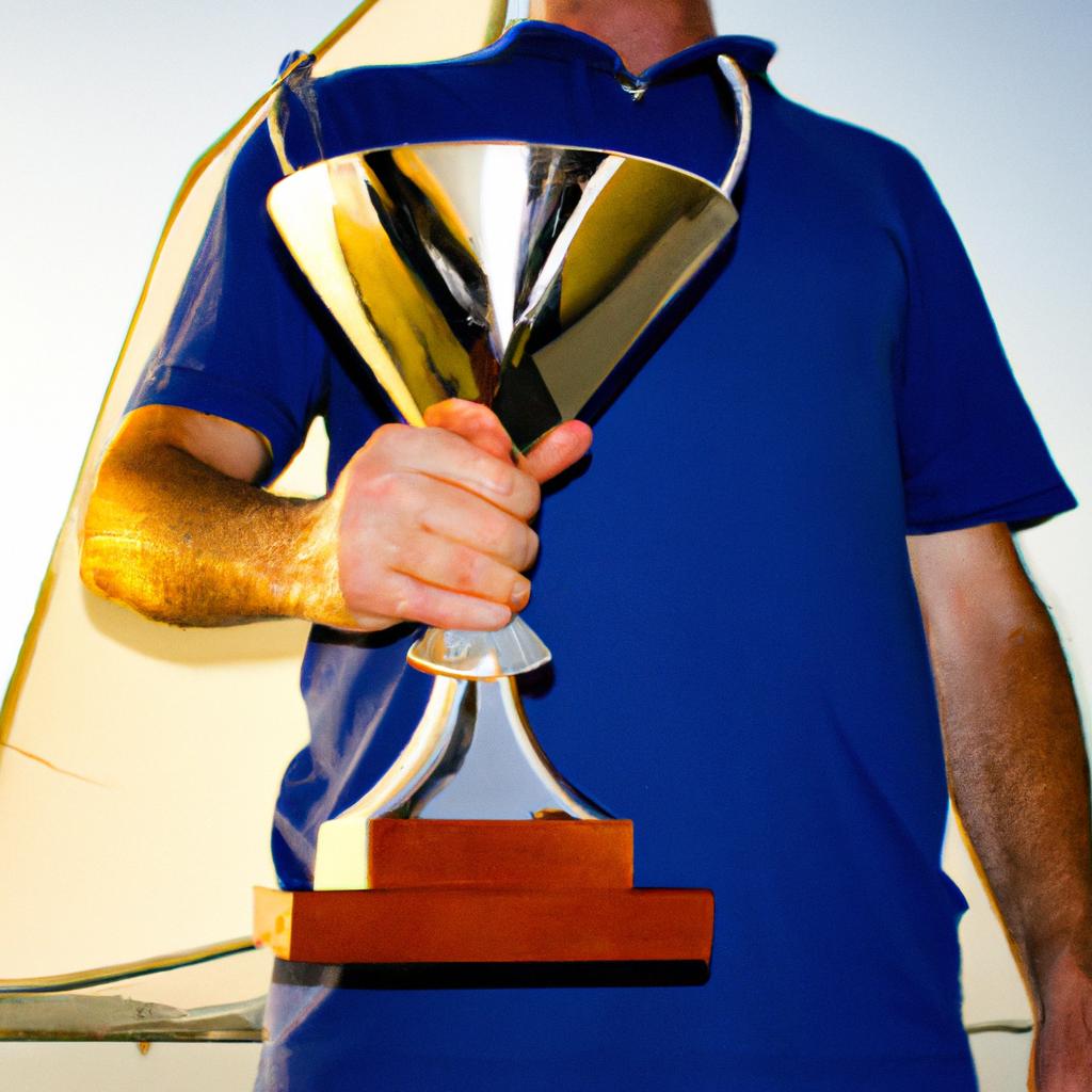 Person holding yacht racing trophy